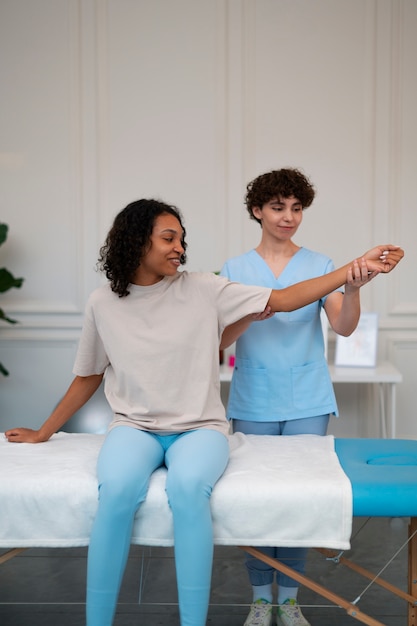 Free photo woman in a rehabilitation center getting treatment