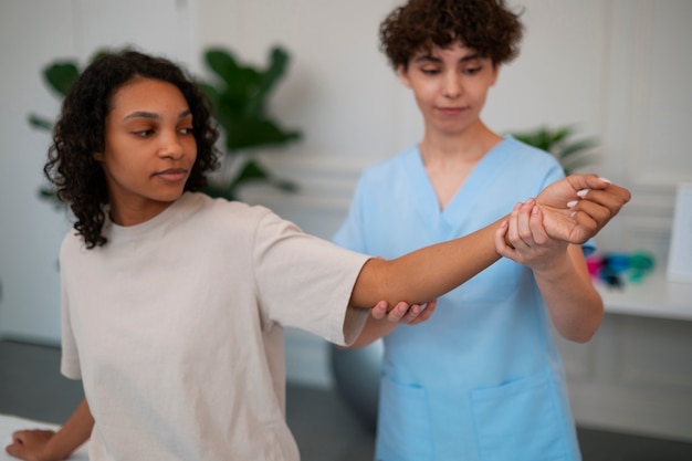 Free photo woman in a rehabilitation center getting treatment