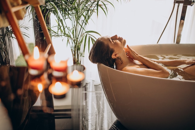 Free photo woman relaxing in bath with bubbles