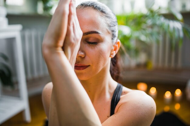 Woman relaxing in eagle pose