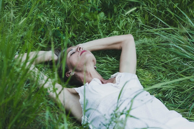 Woman relaxing on grass