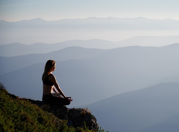 Woman relaxing and meditating on fresh air