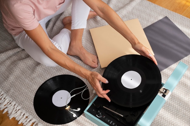 Woman relaxing while listening to music at home