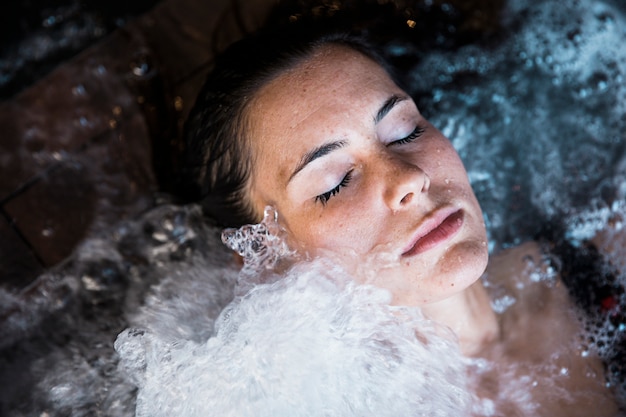 Woman relaxing in whirlpool