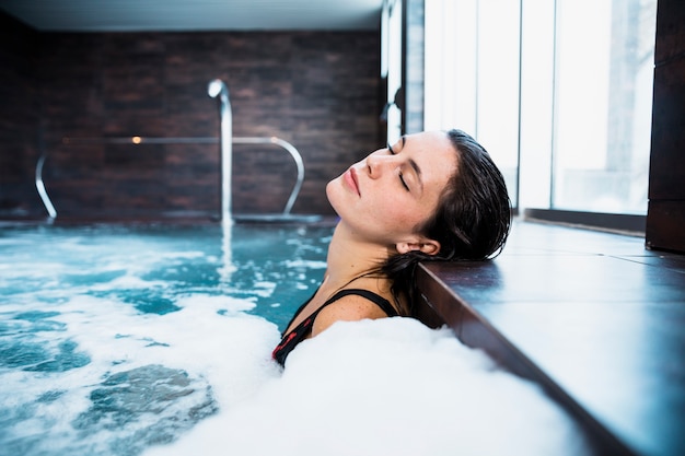 Woman relaxing in whirlpool