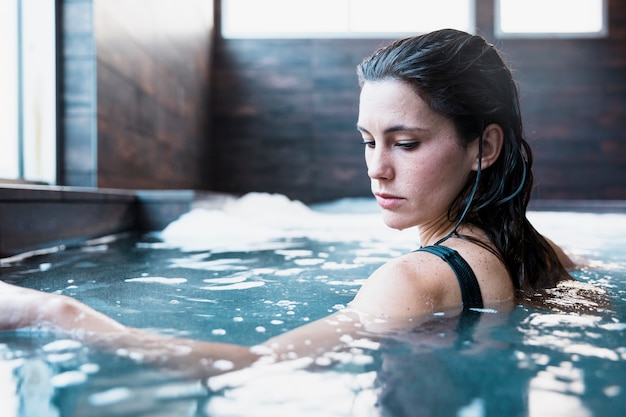 Woman relaxing in whirlpool