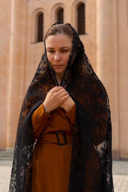 Woman during religious pilgrimage at the church