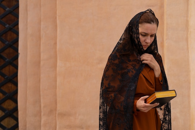 Free Photo woman during religious pilgrimage at the church