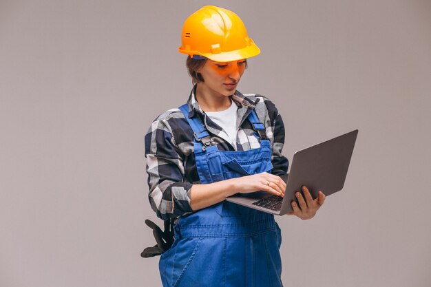 Woman repairer isolated with laptop