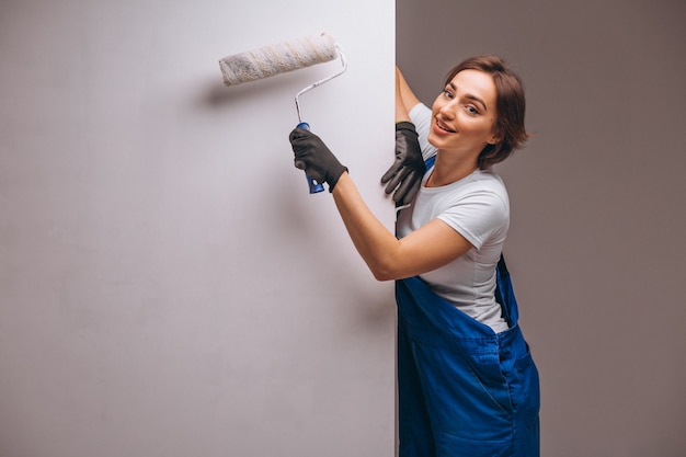 Woman repairer with painting roller isolated