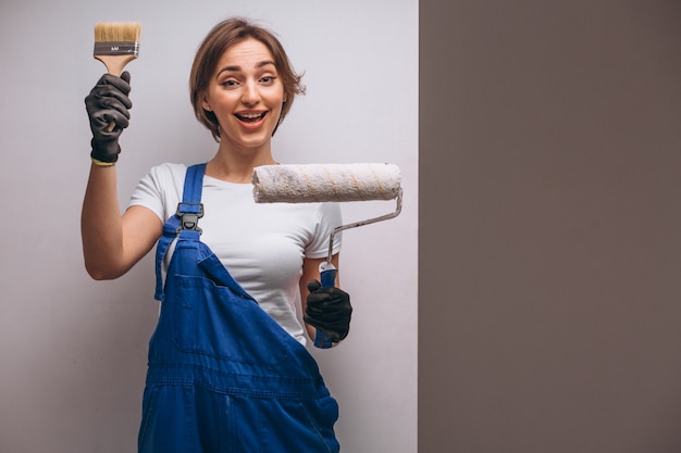 Free photo woman repairer with painting roller isolated