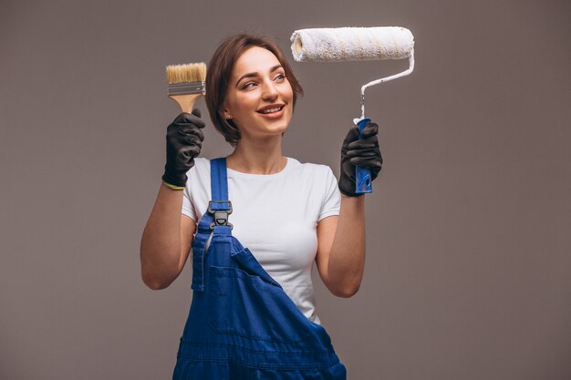 Woman repairer with painting roller isolated