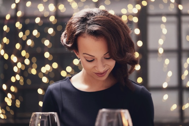 Woman in restaurant looking the menu