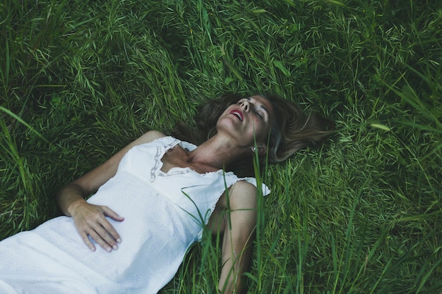 Woman resting on grass