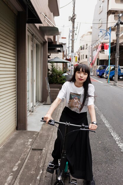 Woman riding electric scooter in the city