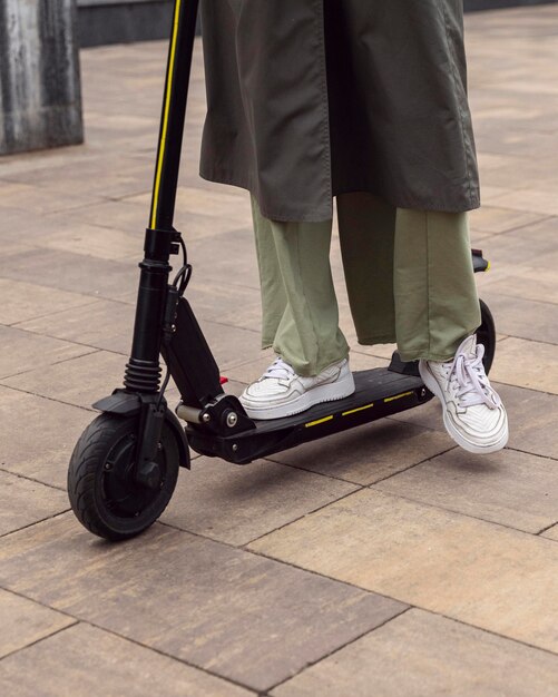 Woman riding her electric scooter outdoors