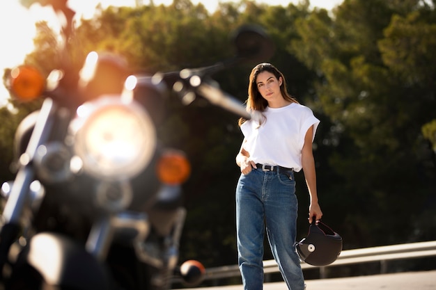 Woman on a road trip with a motorcycle