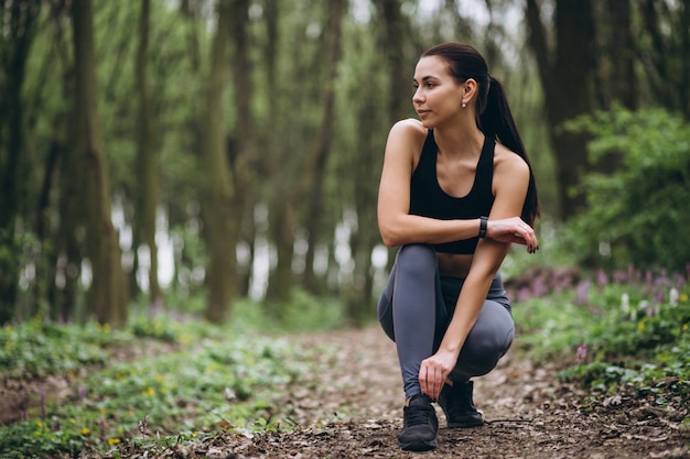 Woman running in forest