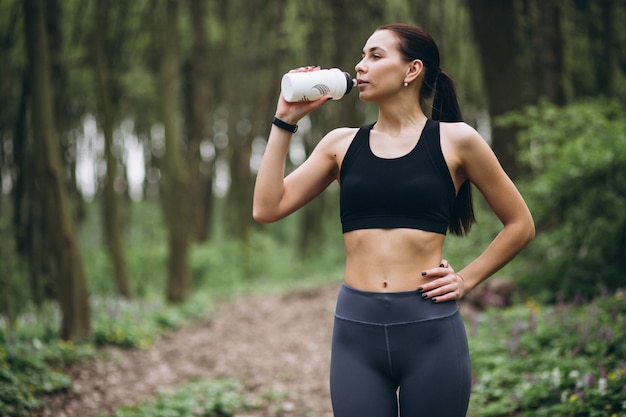 Woman running in forest