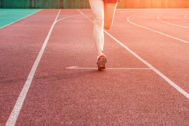 Woman running on a sport track