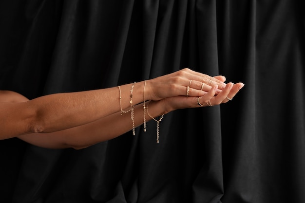 Free photo woman's arms wearing beautiful jewelry