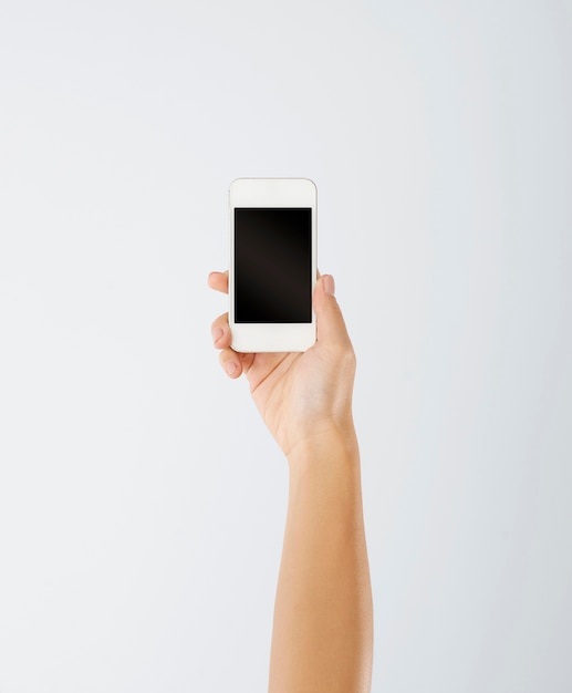 Woman's hand holding contemporary mobile phone