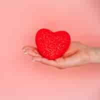 Free photo woman's hand with decorative heart