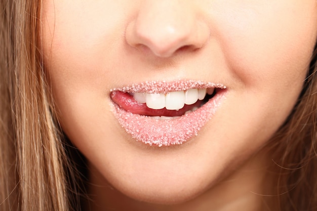 Woman's lips covered with sugar