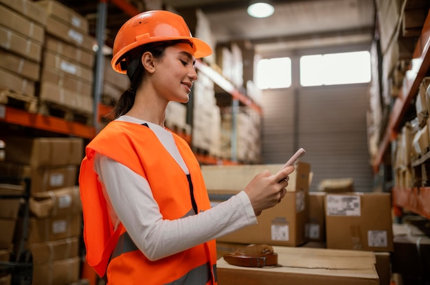 Woman in safety equipment working