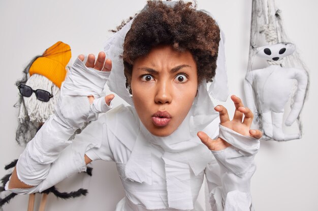 woman says boo plays trick or treat celebrates Halloween at home dressed as ghost