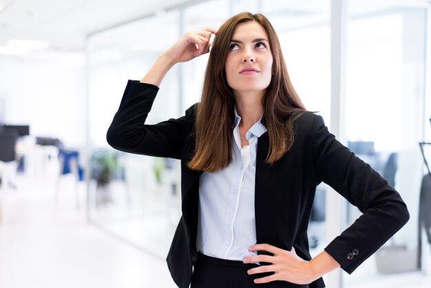 Woman scratching his head