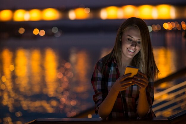 Woman sending text message on phone. portrait of a beautiful gir