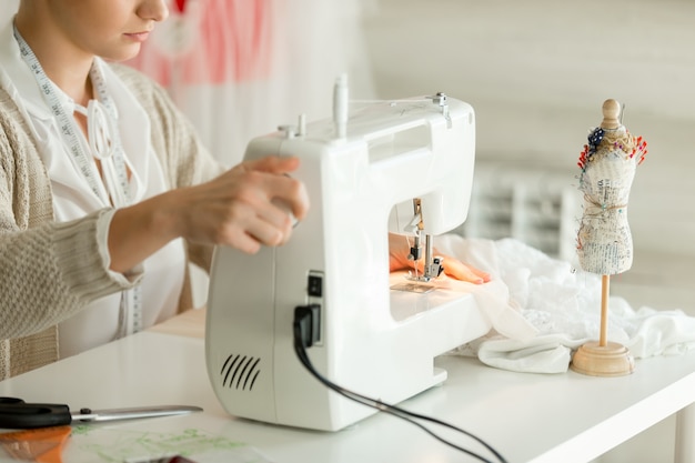 Free photo woman at a sewing machine