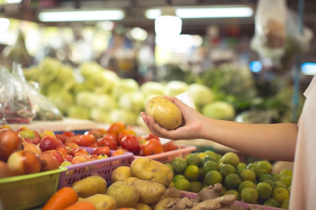 Free photo woman shopping organic vegetables and fruits