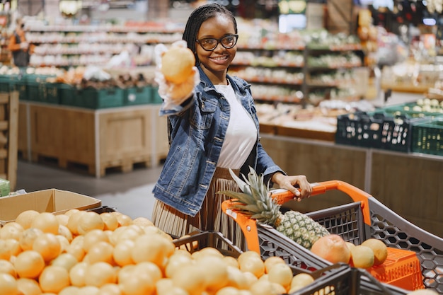 Woman shopping vegetables at the supermarket