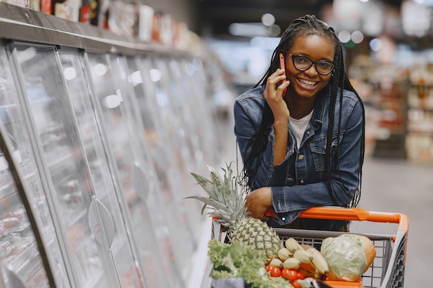 Woman shopping vegetables at the supermarket