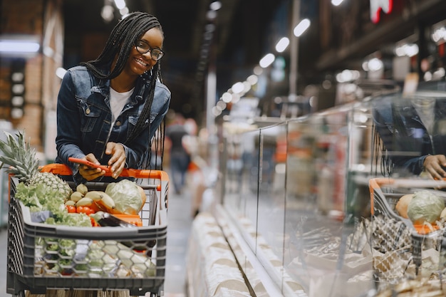 Woman shopping vegetables at the supermarket