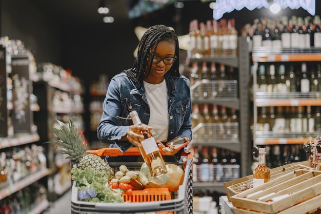 Woman shopping vegetables at the supermarket