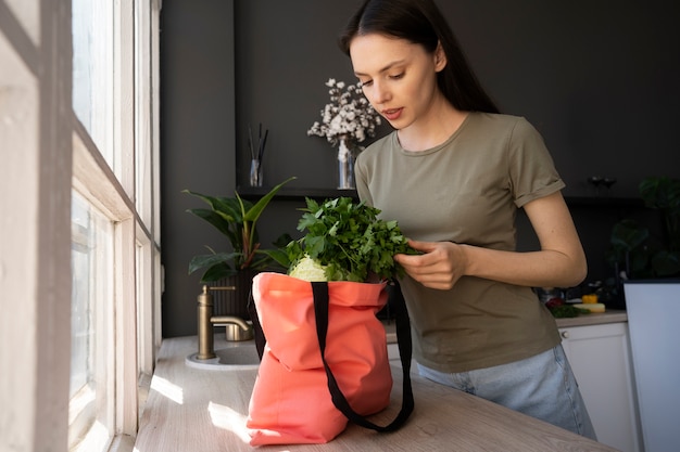 Free photo woman shopping with fabric tote bag