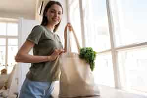 Free photo woman shopping with fabric tote bag