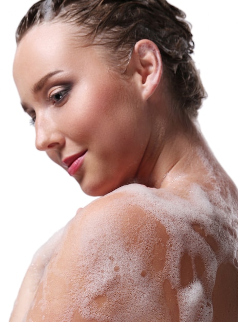 Free Photo woman showering with soap on the body and head. hygiene and skin care concept