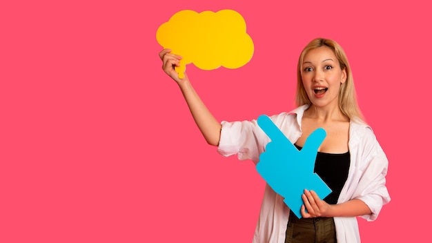 Free Photo woman showing banner looking happy excited on pink background