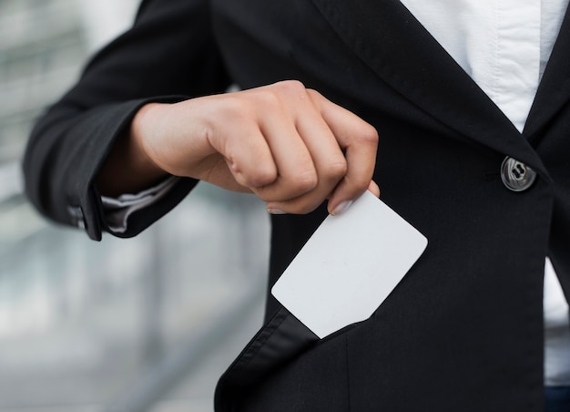 Free Photo woman showing business card mock-up