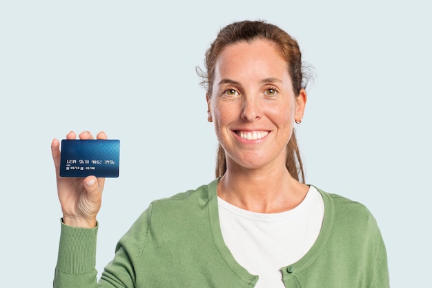 Free photo woman showing a credit card