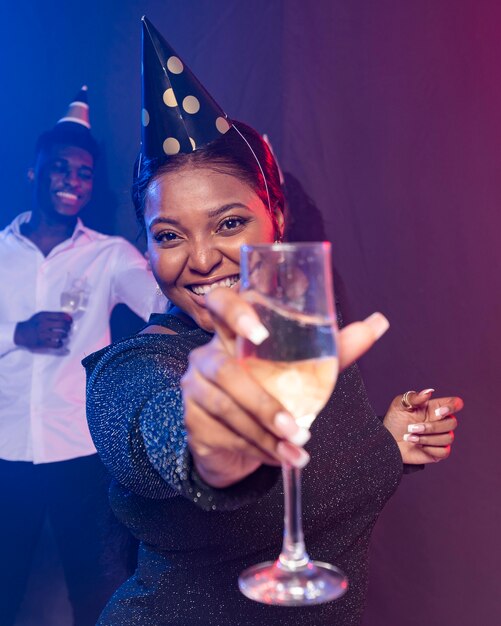 Woman showing her champagne glass