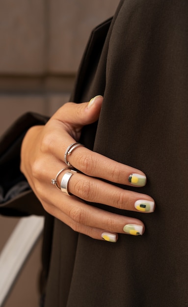 Free Photo woman showing her nail art on fingernails