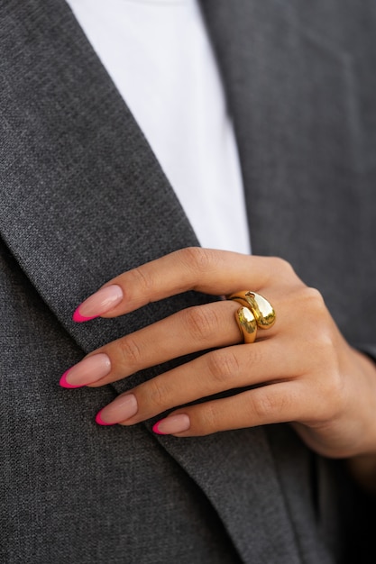 Free photo woman showing her nail art on fingernails