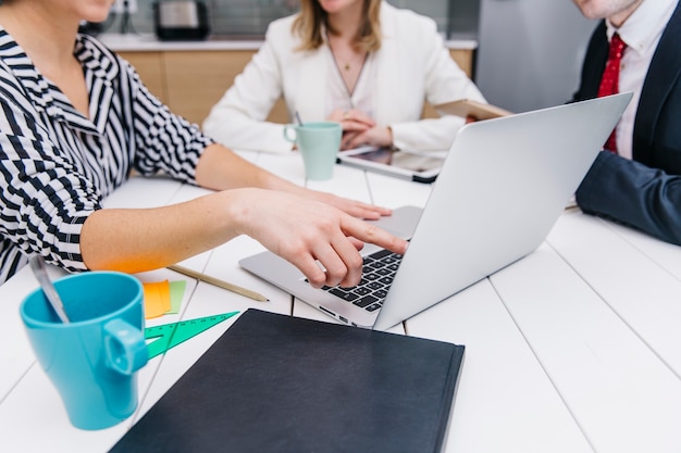 Free Photo woman showing information on laptop