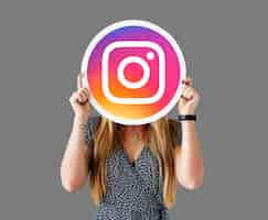 Free photo woman showing an instagram icon