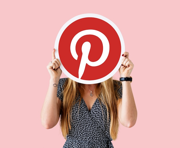 Free photo woman showing a pinterest icon